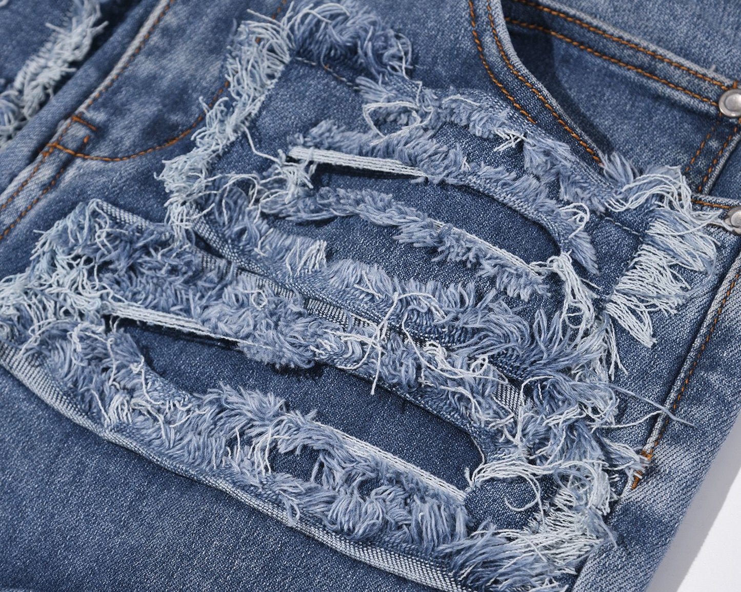 Ripped Patch Whisker Blue Jeans